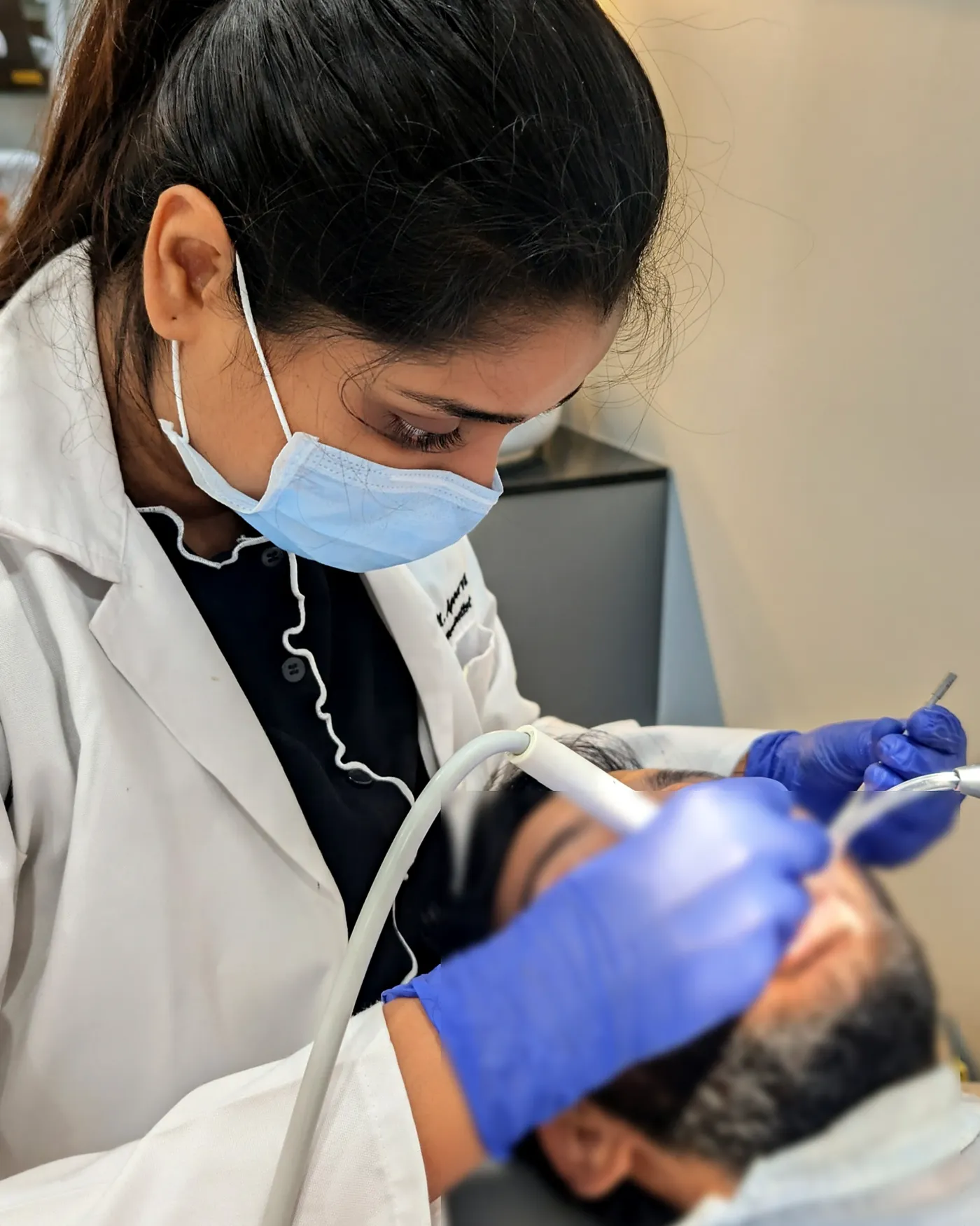 Treatment in progress (patient blurred) at White & Co.