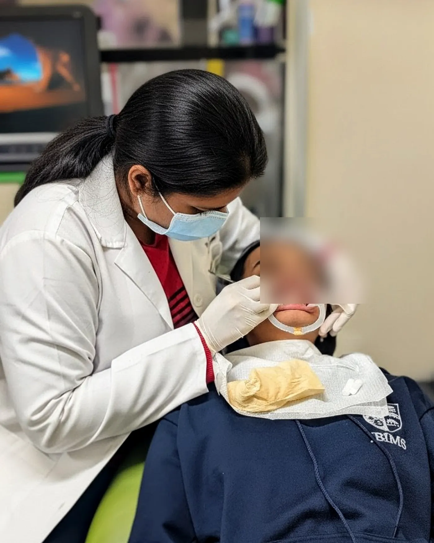 Chairside treatment in progress (patient blurred) at White & Co.