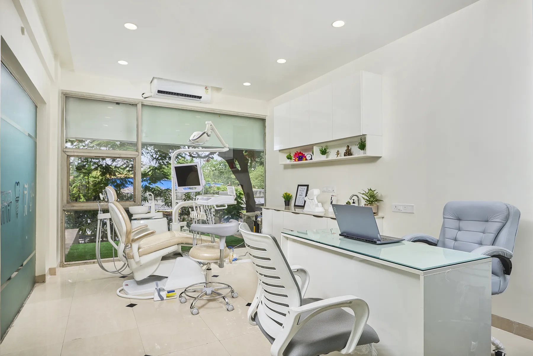 Wide interior view of the consultation area and treatment chair at White & Co. Dental Clinic