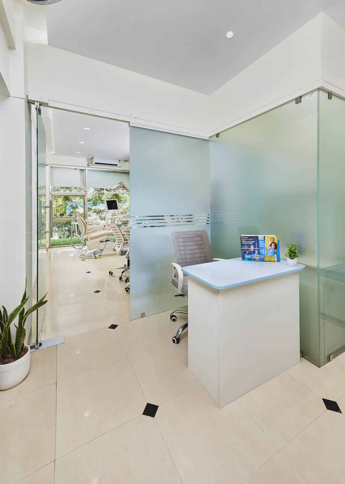 Reception desk and entry into the treatment area at White & Co. Dental Clinic in Aundh, Pune